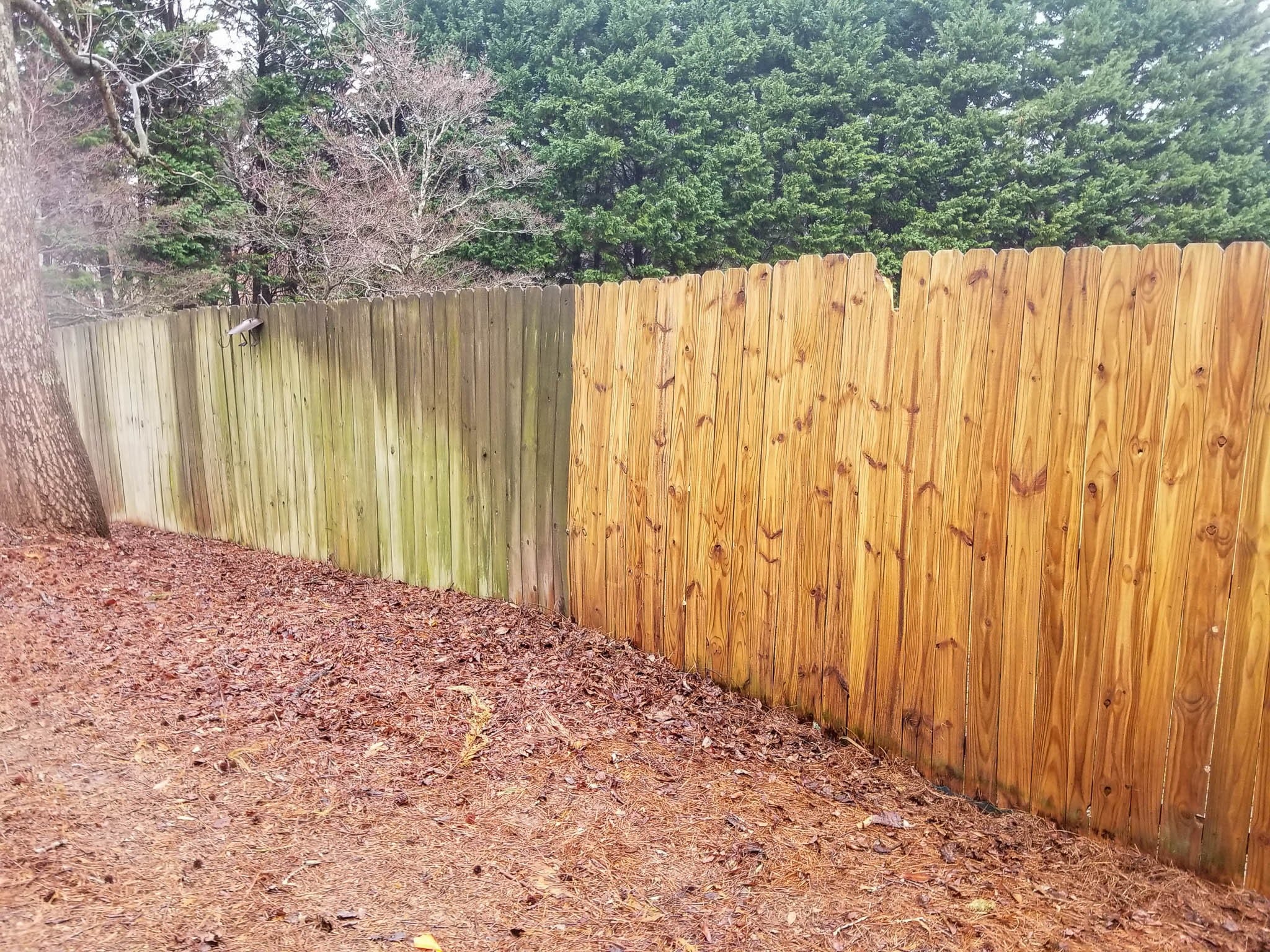 Before and after of fence pressure washing service in progress