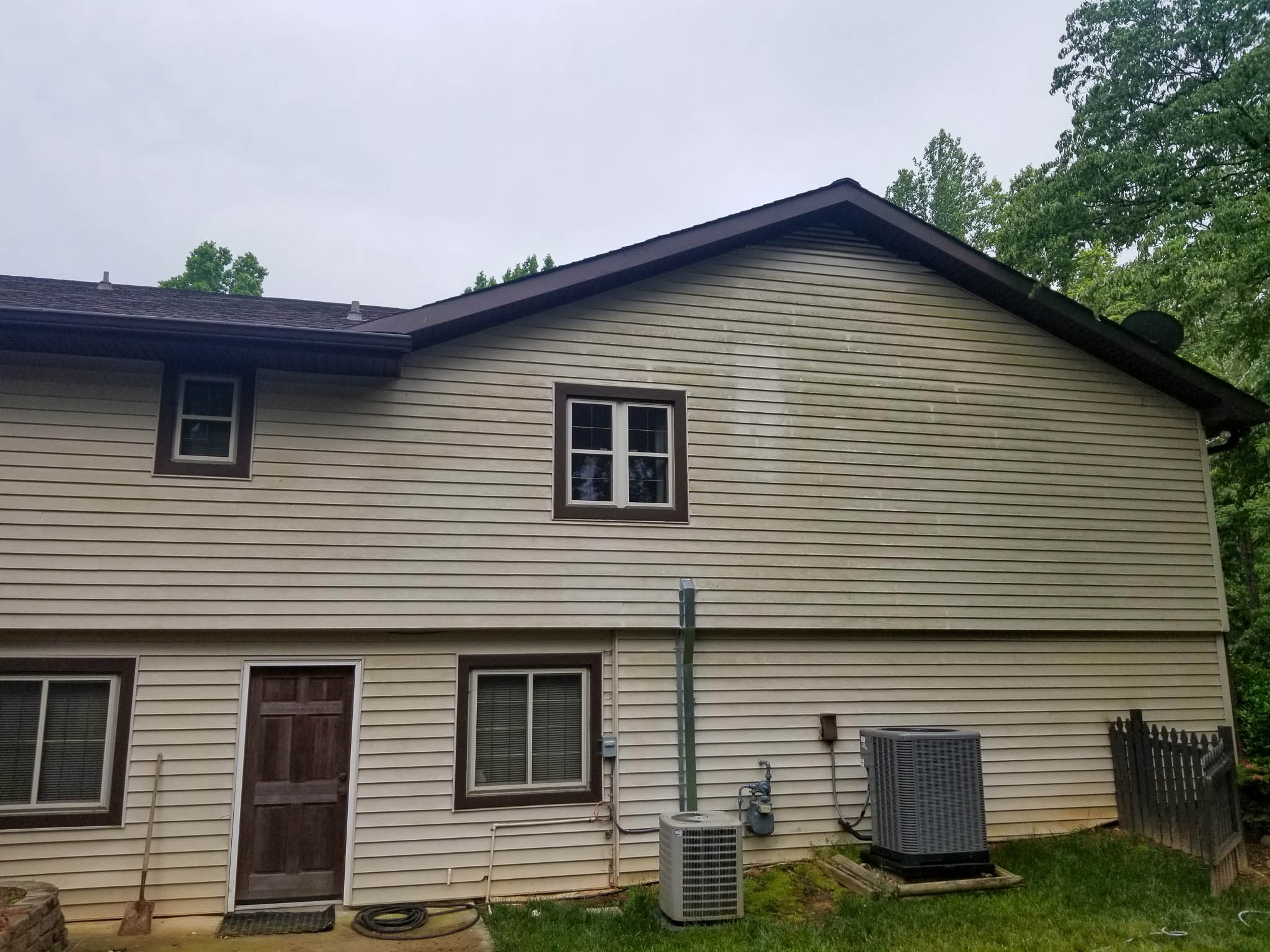 Before: Dingy siding on residential home