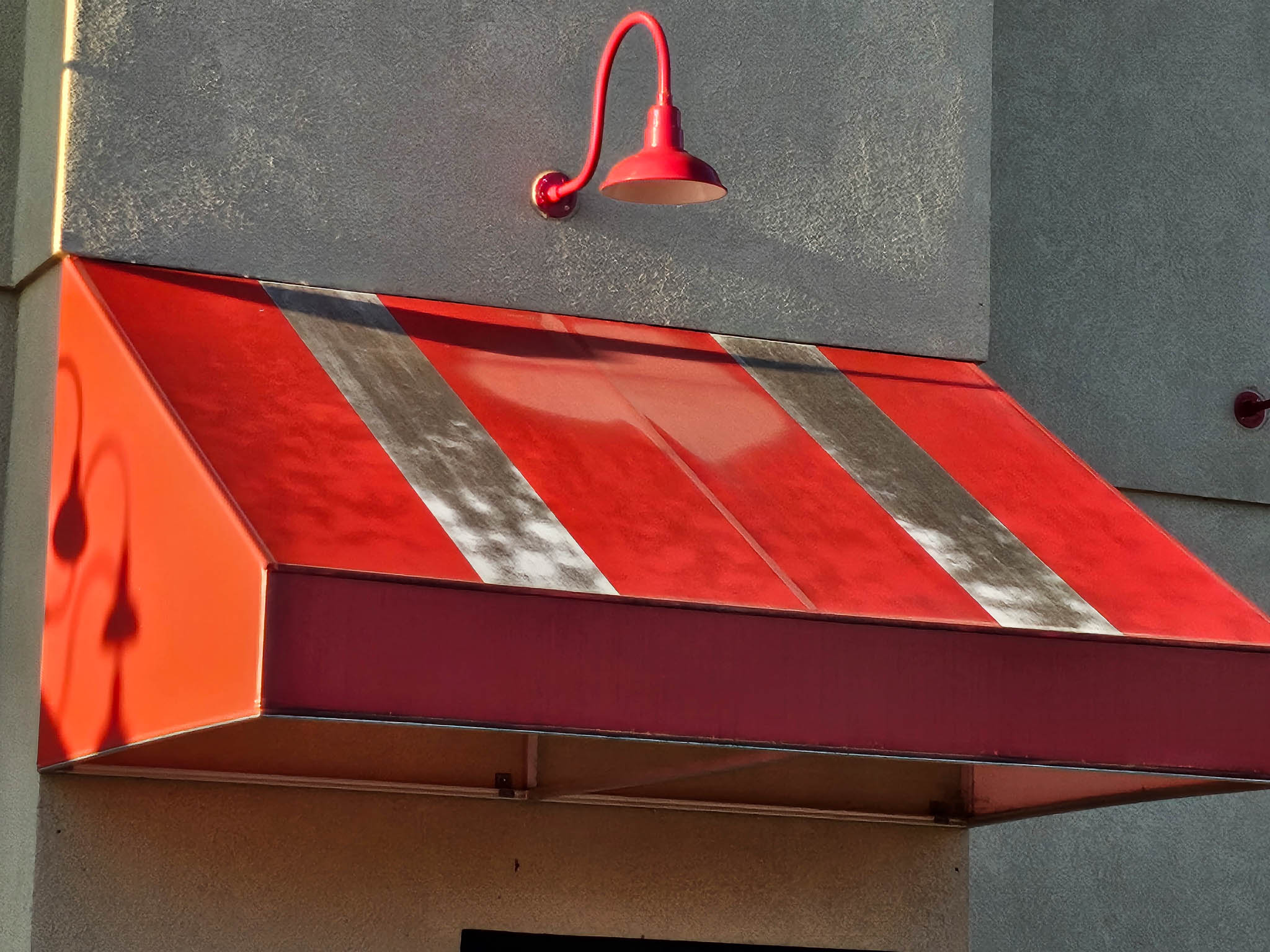 Before: Franchise restaurant awning before pressure washing
