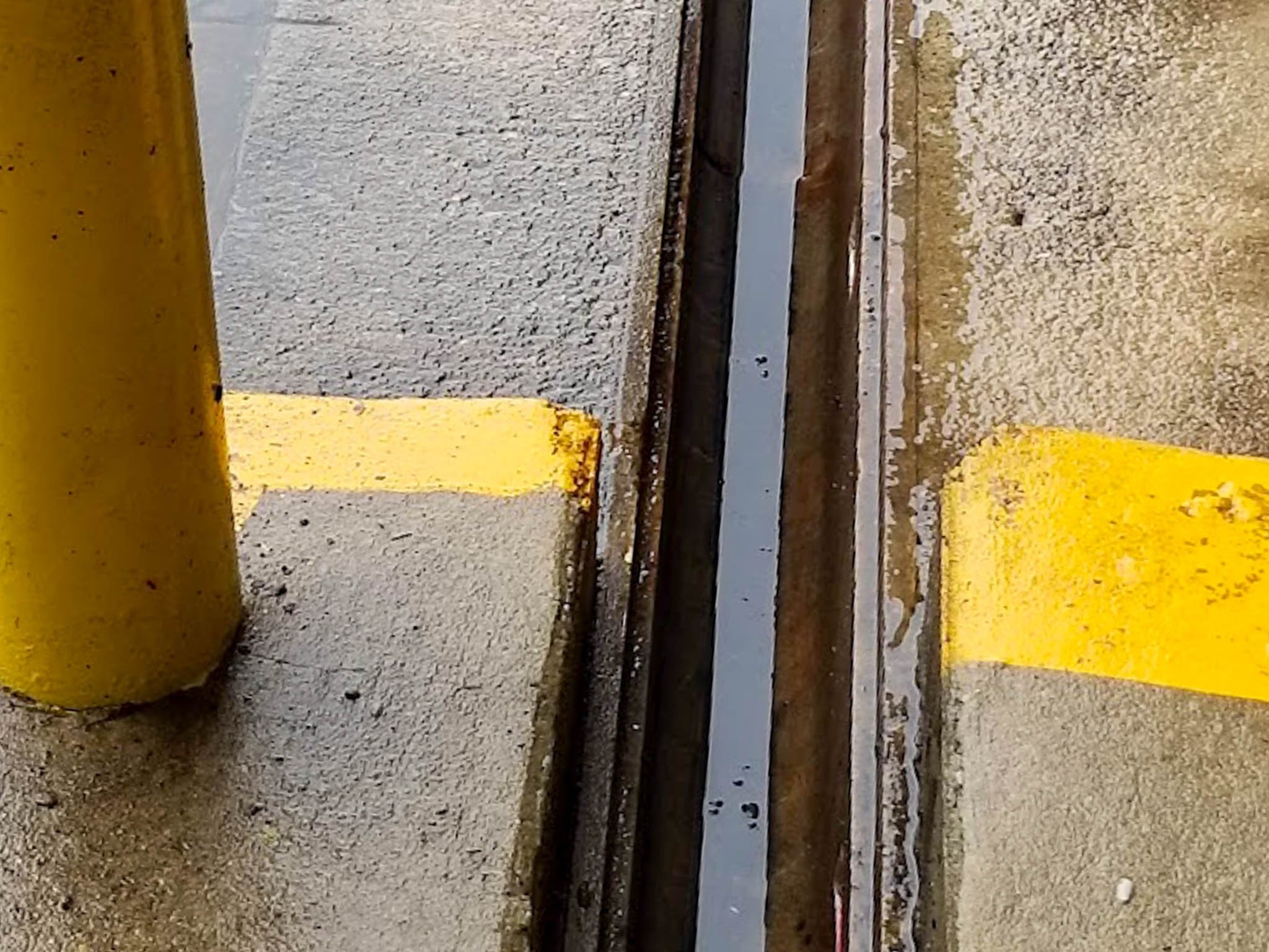 After parking lot grate and gutter cleaning