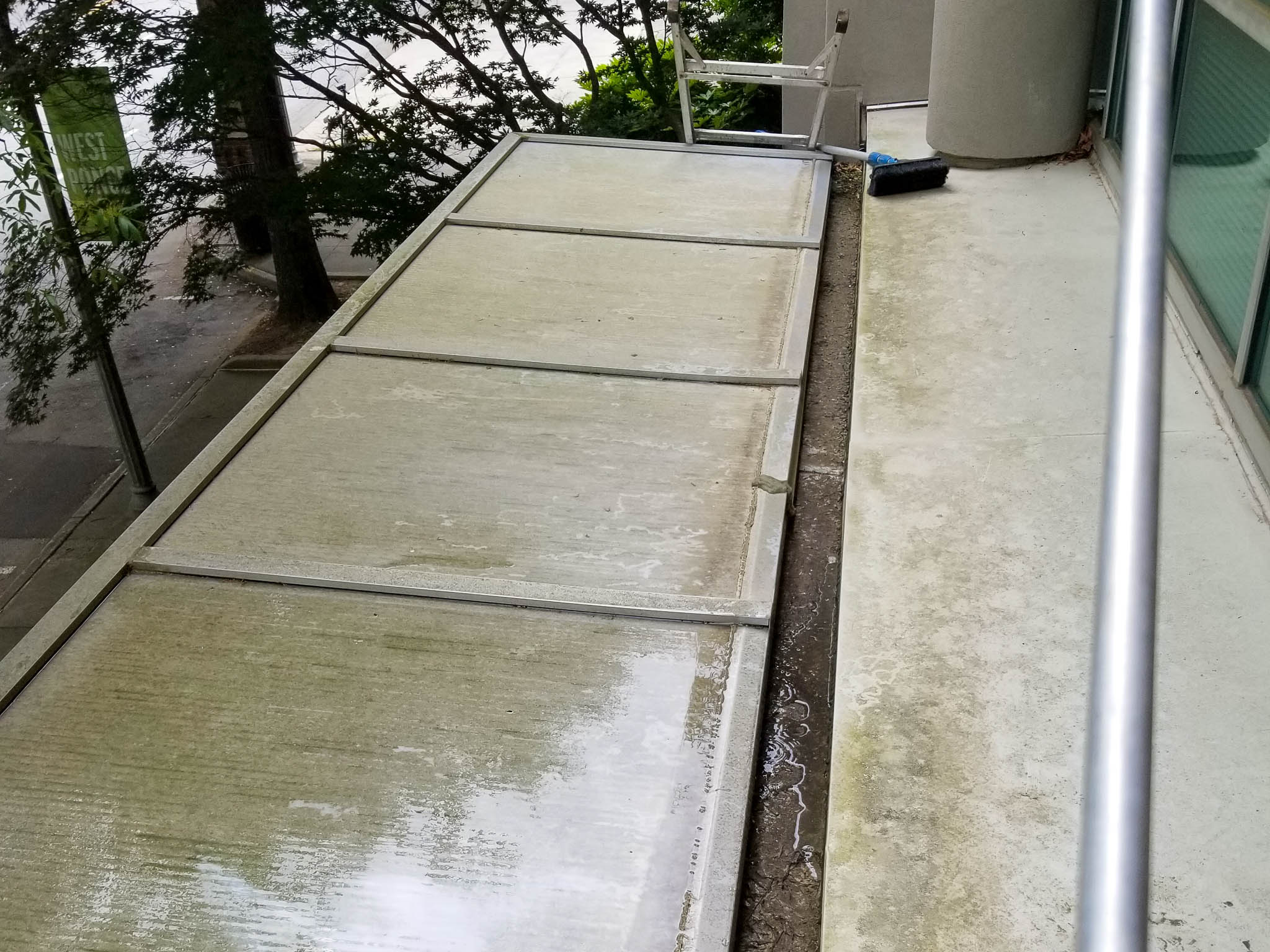 Before pressure washing commercial office skylight and gutter cleaning
