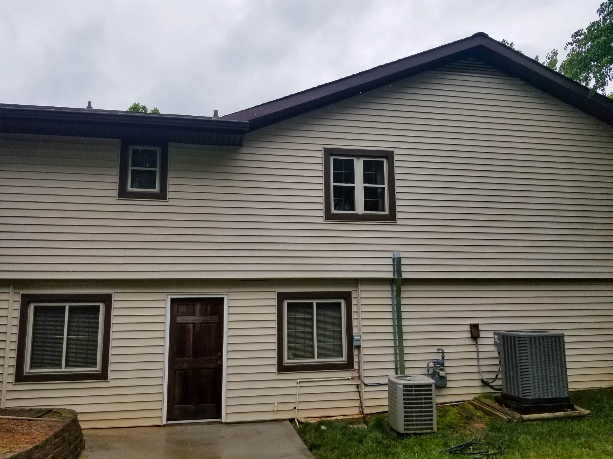 After: Pressure washing siding on residential home restores and protects siding